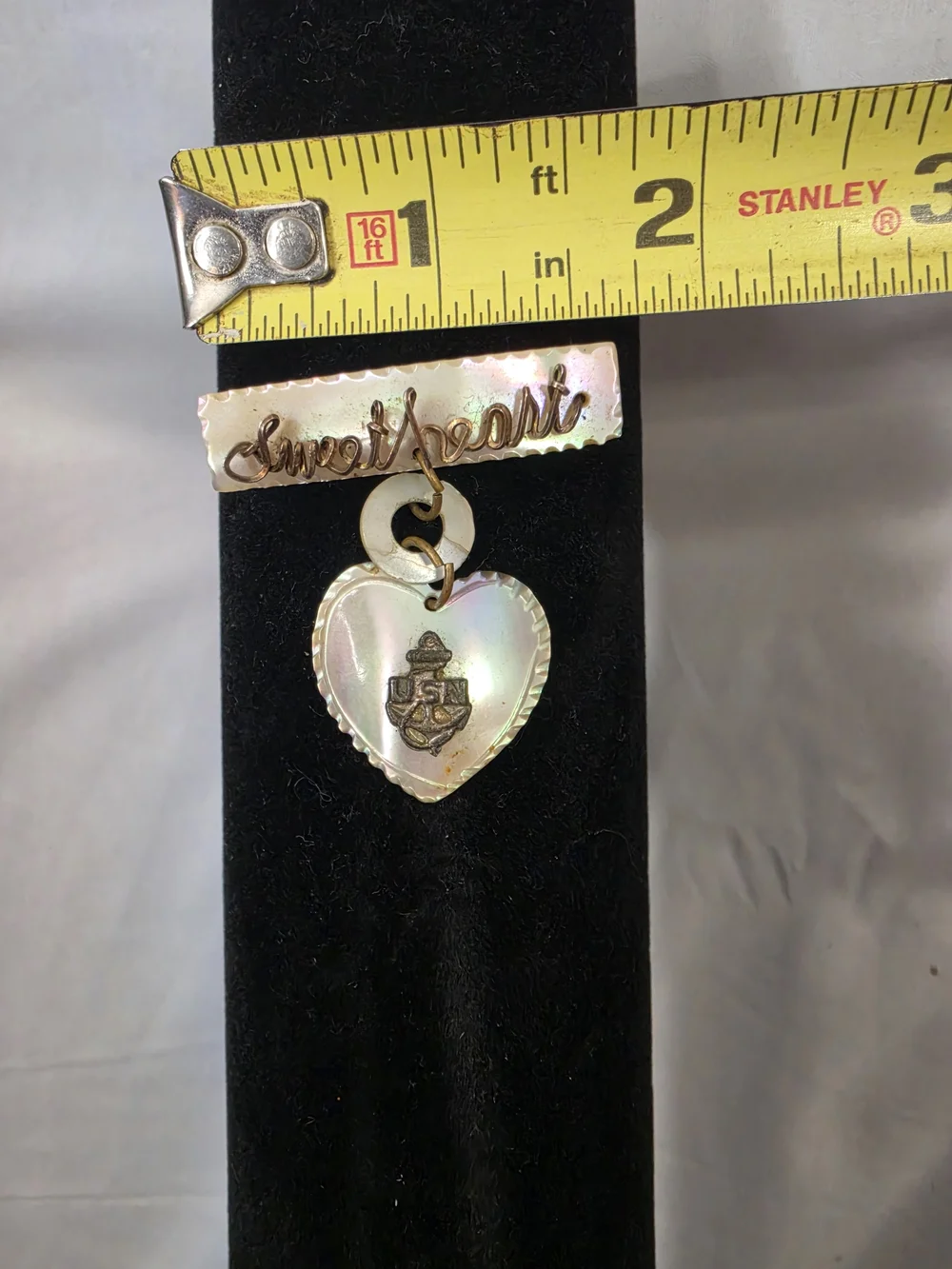 Vintage World War II-era U.S. Navy sweetheart brooch, made from carved MOP